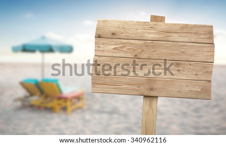 A portrait of a vintage rustic wooden sign on the beach