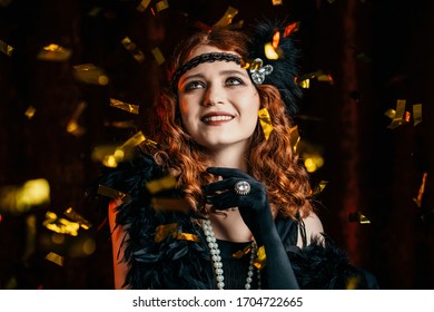 Portrait Of Vintage Styled Woman Dressed In Great Gatsby Era Dancing Under Confetti Rain On Velours Background. Roaring Twenties, Retro, Party, Fashion Concept