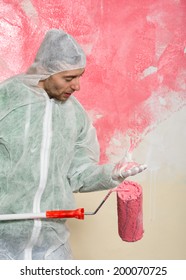portrait of wall painter looking at his brush