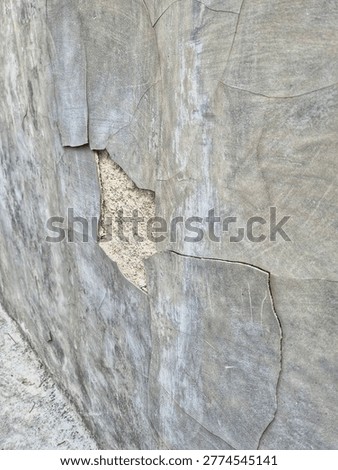Portrait of a wall that has changed color and texture due to the ravages of time