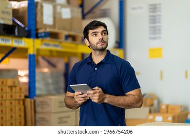 Portrait of warehouse male worker using digital tablet in factory warehouse. Inspection quality control - Powered by Shutterstock