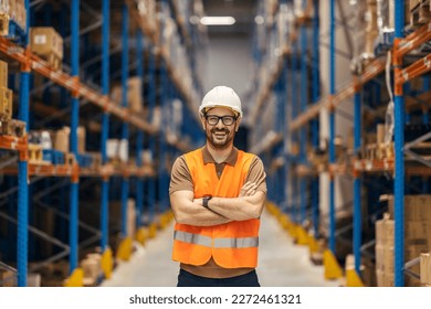 Portrait of a warehouse manager is standing in distribution center and smiling at the camera. - Powered by Shutterstock