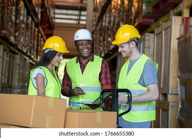 Portrait of warehouse team discuss about work in a warehouse. - Powered by Shutterstock