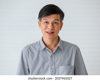 Portrait Of Warm Personality Senior Older Asian Man In Casual Dress Friendly Pose And Looking To Camera With Successful Feeling And Self-confident.