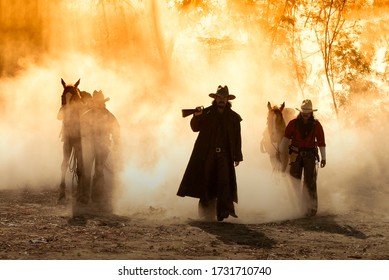 Portrait western cowboys riding horses, roping wild horses in Mexico and America.Smoke background. - Shutterstock ID 1731710740