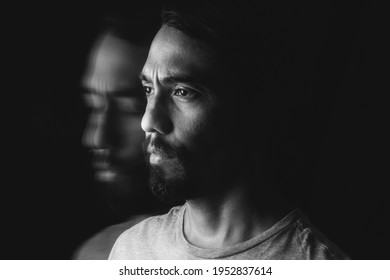 Portrait Of A Wide-eyed Latino Man Wearing A Beard And A Second Image Of Himself With His Eyes Closed And His Face Slightly Down. Long Exposure Image. Mental Illness Concep