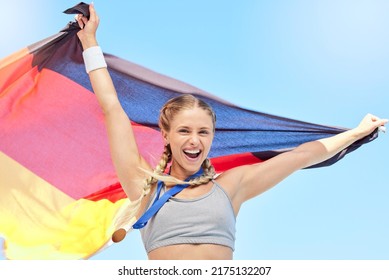 Portrait Of Winning Athlete Cheering, Holding German Flag After Competing In Sports. Smiling Fit Active Sporty Motivated Woman. Celebrating Achieving A Gold Medal In Olympic Sport With National Pride