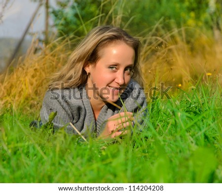 Similar – Lachend im Gras liegend, Augen geschlossen.