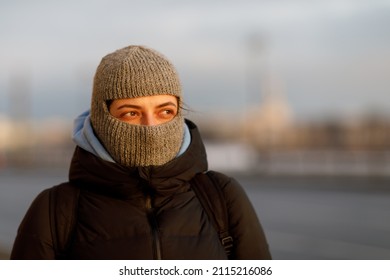 Portrait Of A Woman In A Balaclava In Sunny Weather In Winter