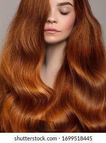 Portrait Of A Woman With Bright Wavy Red Hair. Copycpase