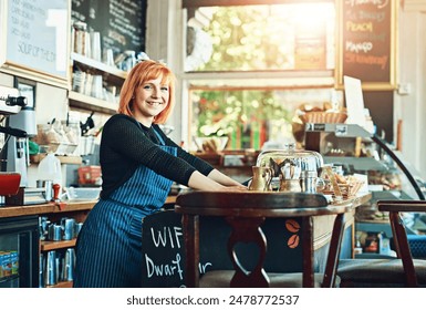 Portrait, woman and cafe as waitress in small business with happiness in restaurant or coffee shop. Female person, cafeteria and bistro for food service as entrepreneur in startup in New York City - Powered by Shutterstock