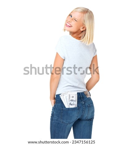 Portrait, woman and cash in pocket, wink and casual outfit with female isolated on white studio background. Face, lady and happy girl with money, finance and wealth with dollars, winning and backdrop