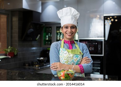 Portrait Of Woman Chef In Kitchen.