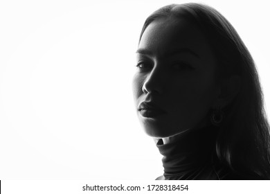 Portrait Of A Woman Close-up On A White Background, Black And White Photo, Silhouette.