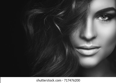 Portrait of  Woman with curly hair and beautiful make-up