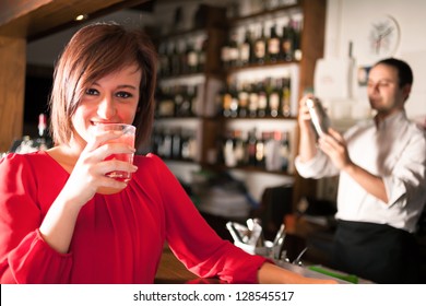 Portrait Of A Woman Drinking A Cocktail