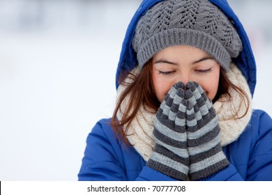 Portrait of a woman feeling cold in winter - outdoors