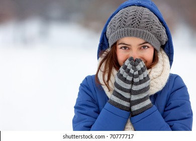 Portrait of a woman feeling cold in winter ? outdoors
