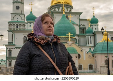 Portrait of a woman in front of an Orthodox church