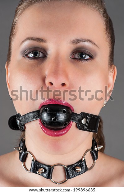 portrait of a\
woman gagged in the image a\
slave
