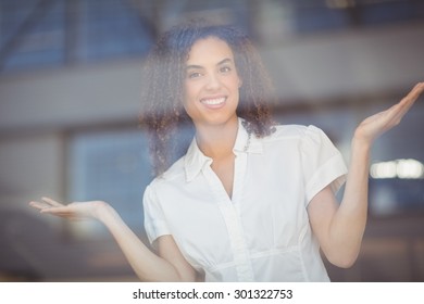 Portrait of a woman gesturing with arms at the coffee shop - Shutterstock ID 301322753