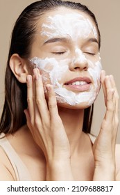 portrait woman hand near face cream rejuvenation charm beige background - Shutterstock ID 2109688817