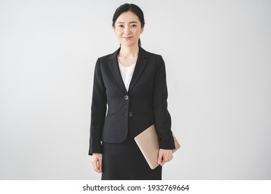 Portrait Of A Woman In Her 40s Wearing A Suit