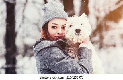 Portrait Of A Woman With Her Beautiful Dog Hugging Outdoors 