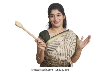 Portrait Of A Woman Holding Wooden Ladle