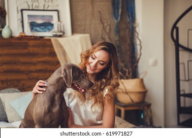 Portrait Of A Woman Hugging A Dog