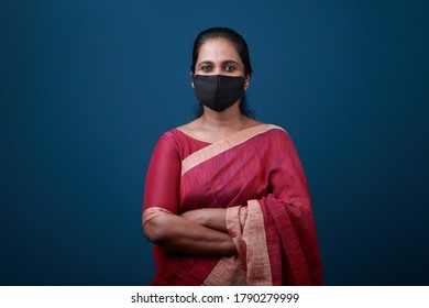 Portrait of a  woman of Indian origin wearing face mask to protect against viral pandemic