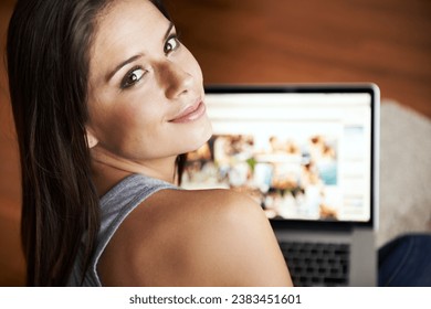 Portrait, woman and laptop screen in home with internet for homepage, website or connectivity. Female web designer, creative or freelance with smile remote work in living room with online network