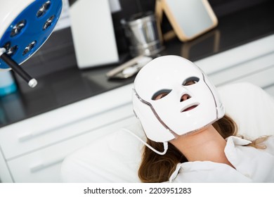 Portrait Of Woman In LED Mask Getting Led Skin Rejuvenation Therapy In Clinic Of Aesthetic Medicine