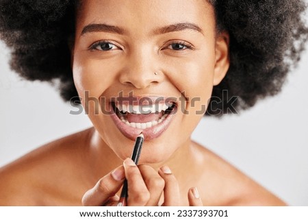 Portrait, woman and lip pencil for makeup, facial skincare and beauty cosmetics in studio. Face, happy black female model and lipstick product for outline of lips, aesthetic makeover and application