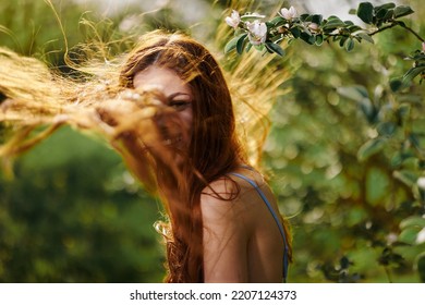 Portrait Of A Woman With Long Flyaway Hair Red Hair In Summer, The Concept Of Health And Care For Long Thick Hair Beauty