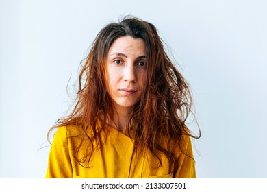 portrait of woman long hair and looking unhappy. Messy hair. Brunette woman with messed hairs. Girl having a bad hair. Bad hairs day.