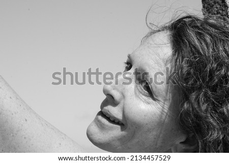 a woman lies on a green sofa. resting.