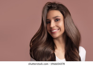 Portrait Of A Woman With Luxurious Hair And A Beautiful Smile. Asian Appearance