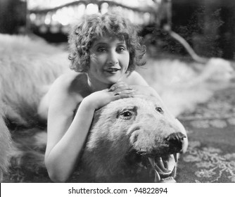 Portrait Of Woman Lying On Bear Rug