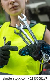 Portrait Of Woman Mechanic Near Broken Down Car On The Road Side. Service