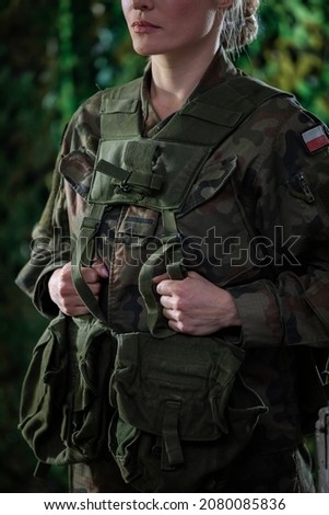 Portrait of a woman in military uniform. Equipping the Polish Army with multipurpose groups.