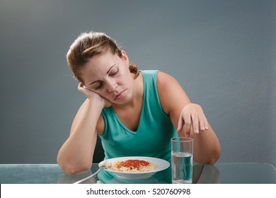 Portrait Of Woman With No Appetite In Front Of The Meal. Concept Of Loss Of Appetite