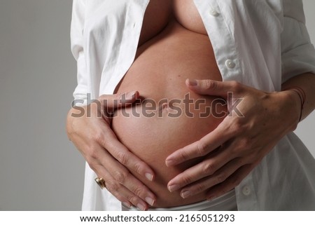 Similar – Image, Stock Photo Top view of hands massaging female abdomen