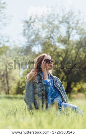 Similar – Happy young woman looking through the window car