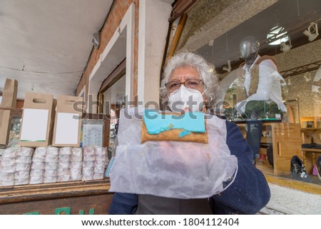 portrait of woman selling traditional mexican sweets