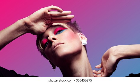 portrait woman and short hair   neon makup gradient background