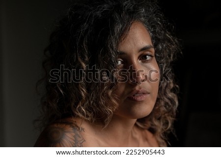 Similar – Portrait of a woman in a lake