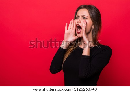 Portrait woman shouting over red background