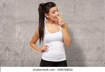 Portrait Of A Woman Showing Granola Bar, Indoor