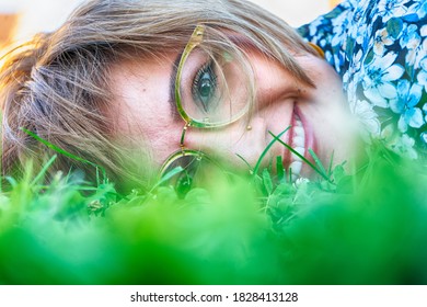 Portrait Of A Woman Sitting In The Grass. HDR Image.